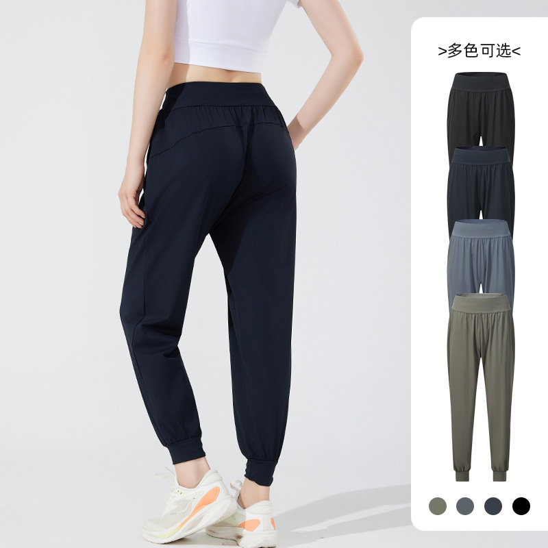 Pantalones deportivos casuales elásticos y transpirables estilo otoño 2026 para mujer, ideales para yoga, correr y fitness al aire libre.