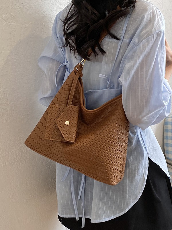 Nicho francés de gran capacidad bolso de hombro para mujeres 2026 nueva moda casual trenzado bolso de mochila universal