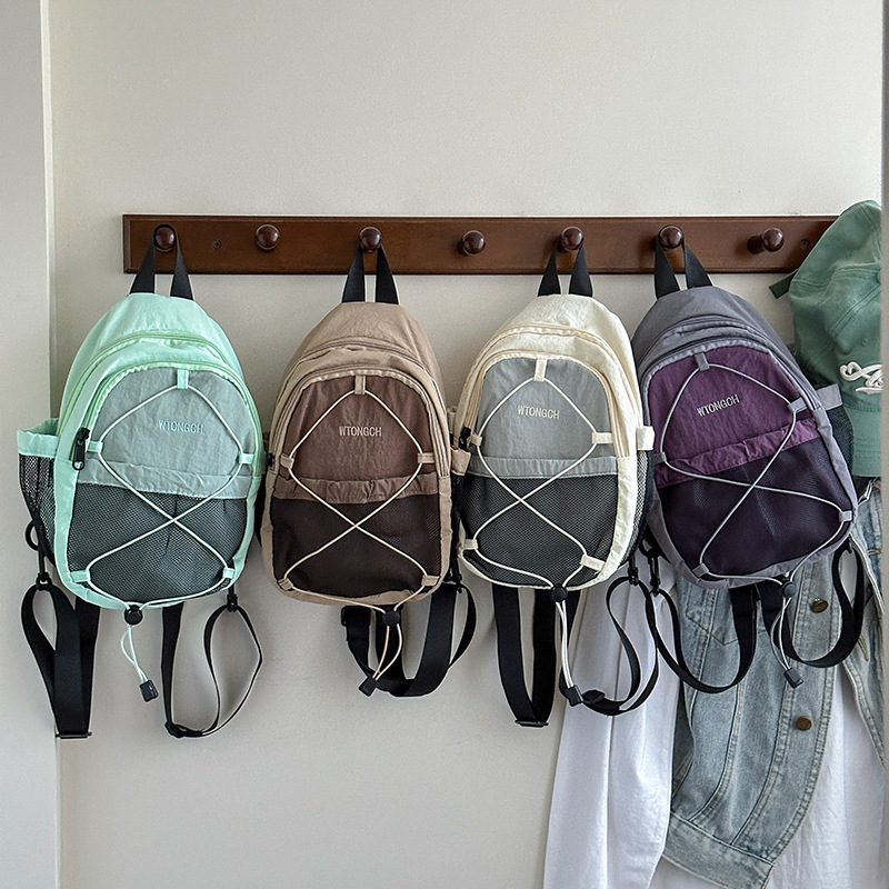 Mochila coreana para niños y niñas, estilo extranjero, bolsas escolares de color contrastante, nueva mochila multifuncional para niños.