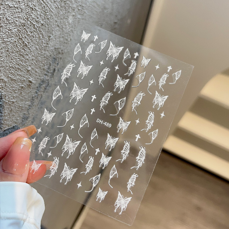 液体の蝶のネイルシールの立体レーザーと金銀の白黒の蝶の薄い靭性帯のゴムを背負って花の爪を貼って卸売りを貼ります。|undefined