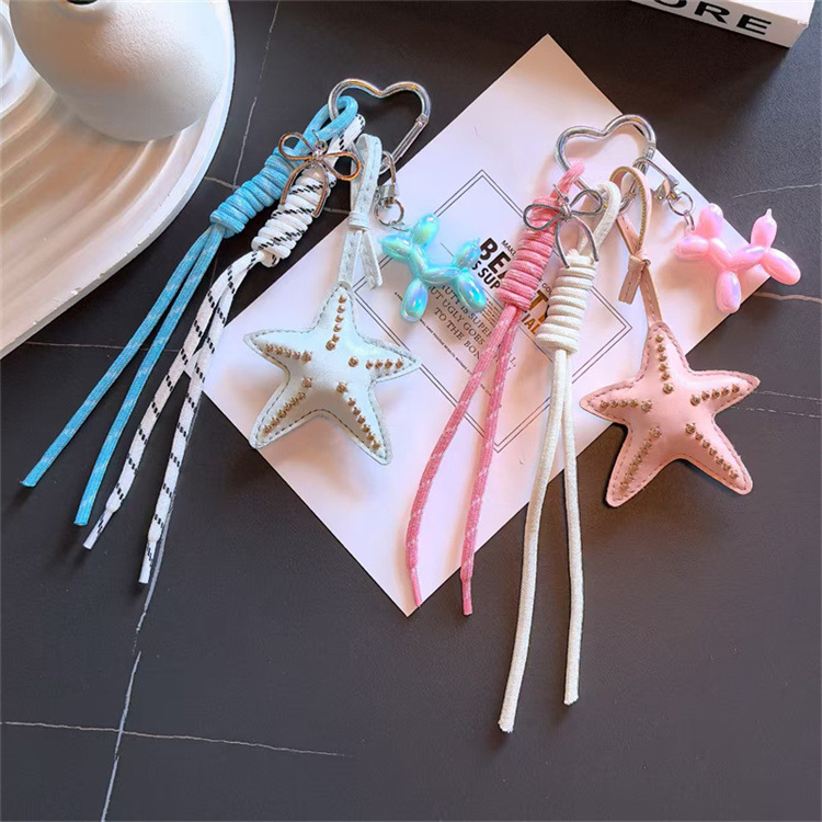 Transición fronteriza Miu Tie Wind Keychain original coreano hecho en casa colgante de arco de viento lindo fabricante de cuerda tejida a mano