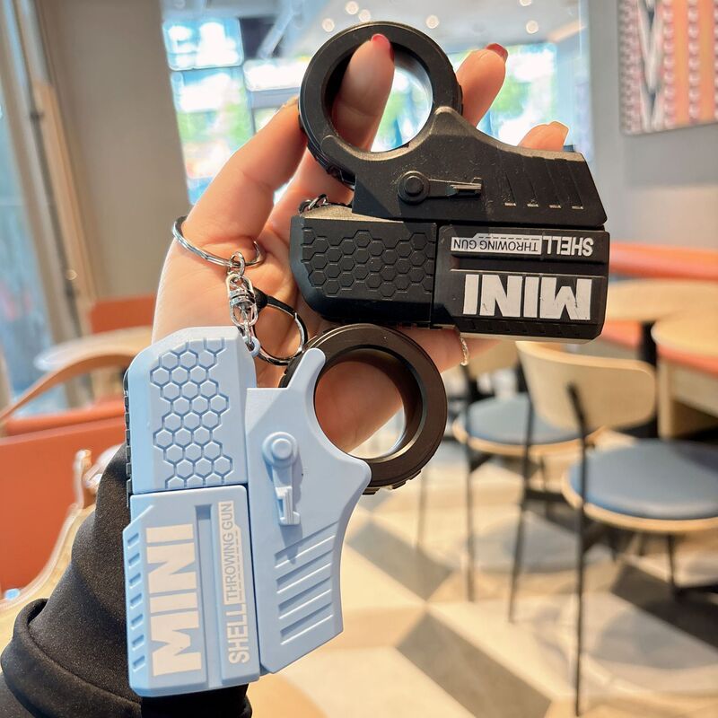 Cross-border large children's finger decompression ring keychain rotating cool can be launched to throw shell novelty toys wholesale