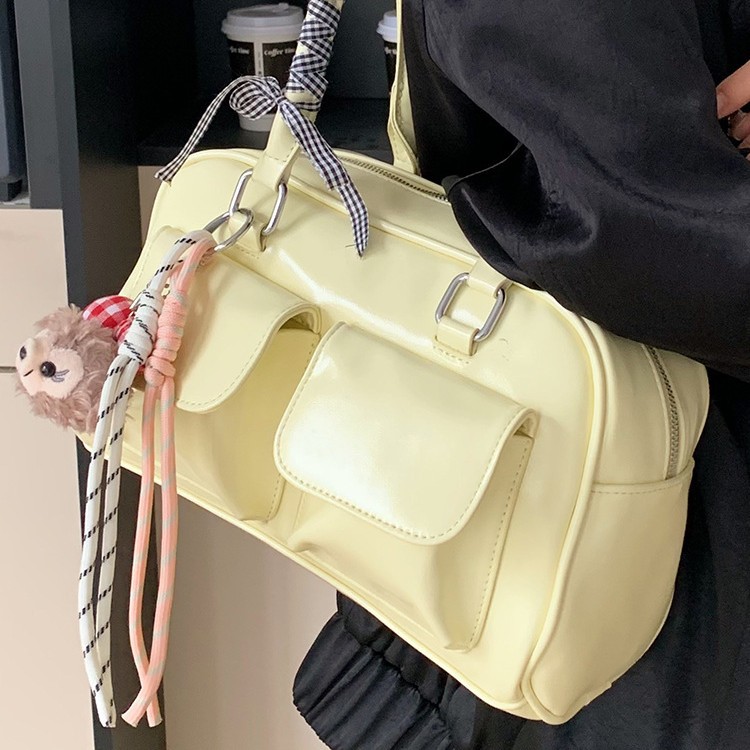 La moda coreana de nicho de estilo extranjero bolsas de palos debajo de las axilas para mujeres 2026 primavera nueva bolsa diaria de Boston bolsas de bolos