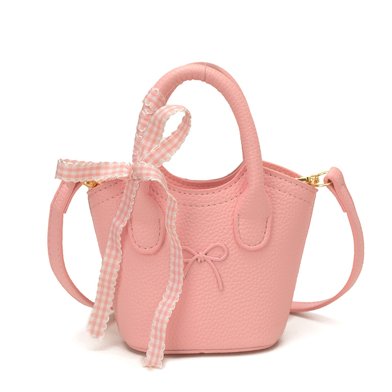 Nuevo bolso para niños coreano simple color sólido bolso de cubo para niños y niñas lindos arco mini bolso de mano bebé