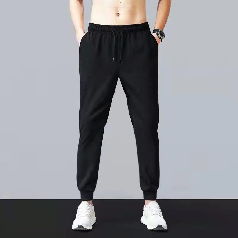 Pantalones deportivos elásticos de lana de cordero gruesos forrados de lana de los hombres pantalones casuales pantalones de los hombres pantalones de invierno ventas directas de fábrica