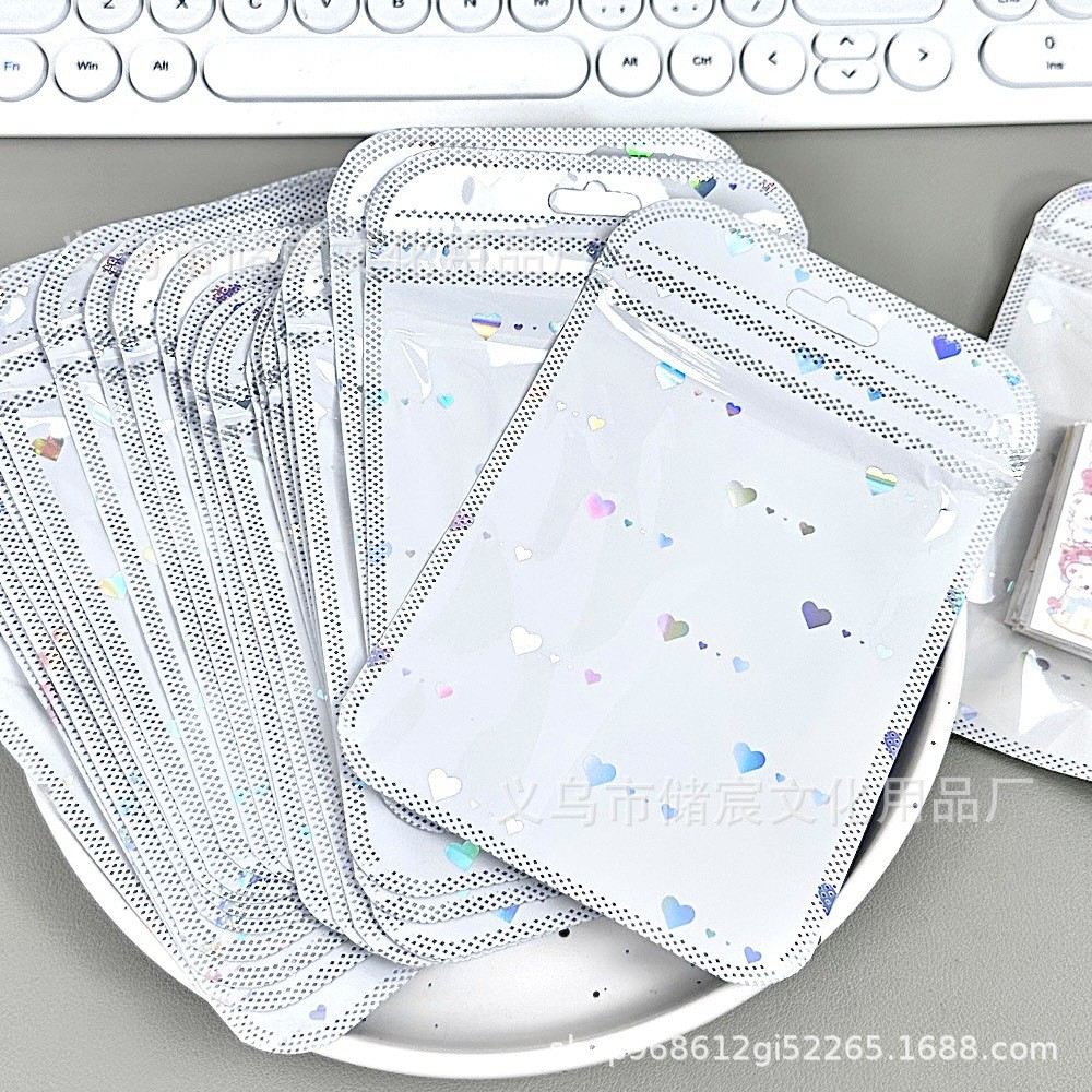 Bolsa autosellante de láser de amor de alta apariencia ins embalaje de tarjeta bolsa de regalo tarjeta pequeña mano cuenta Material embalaje bolsa de sellado