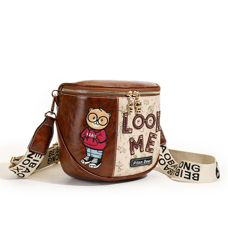 2026 nuevo nicho de diseño sensación de oso bolso de color contraste bolso de teléfono móvil ancho cinturón de hombro bolso de hombro de hombro bolso de silla de mujer