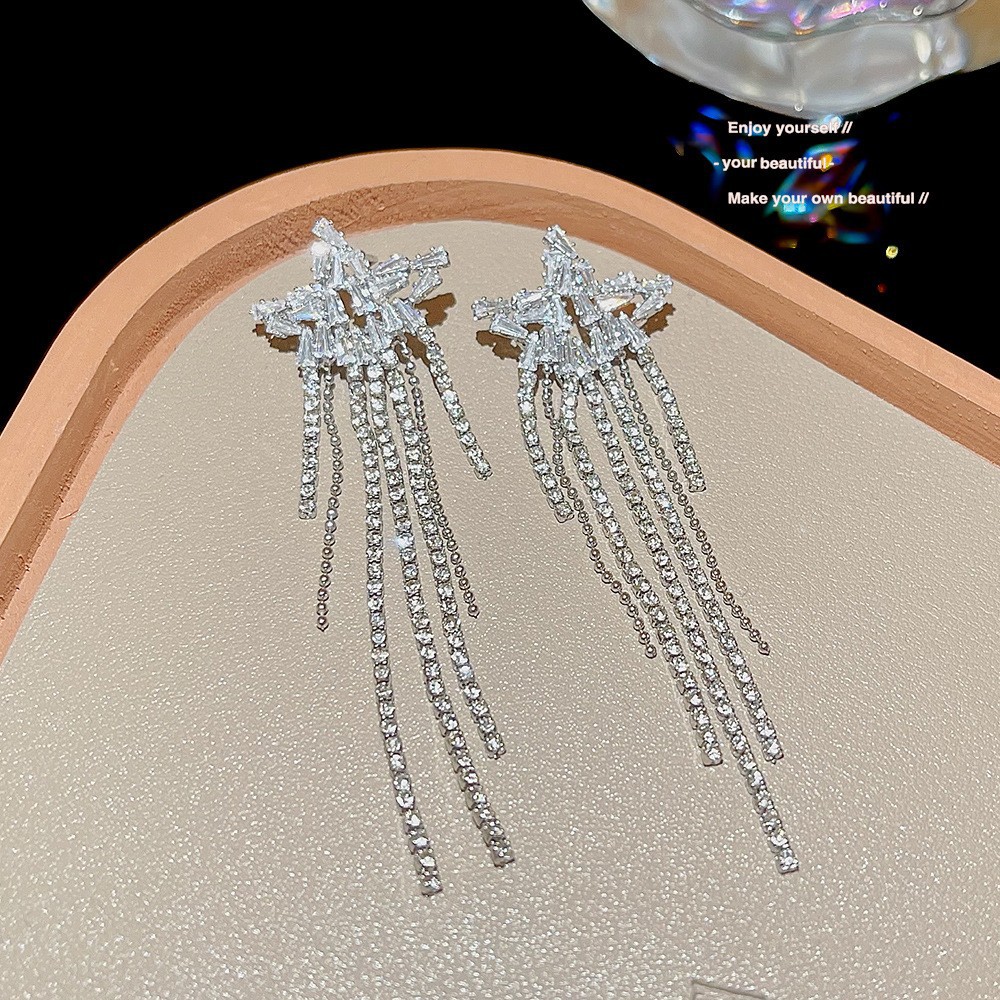 S925 aguja de plata elegante borla pendientes de alta gama simple cara de adelgazamiento pendientes de todo fósforo estilo coreano nuevos pendientes de moda al por mayor