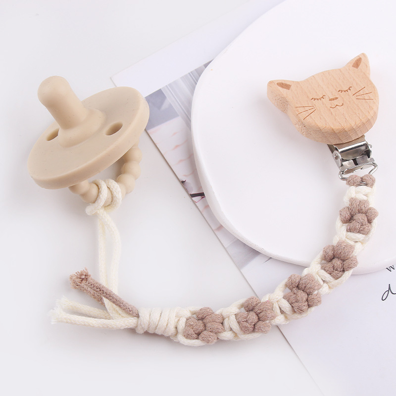 Nuevo clip de chupete de madera de haya de animal de dibujos animados creativo tejido a mano pata de perro textura chupete de algodón cadena anti-caída