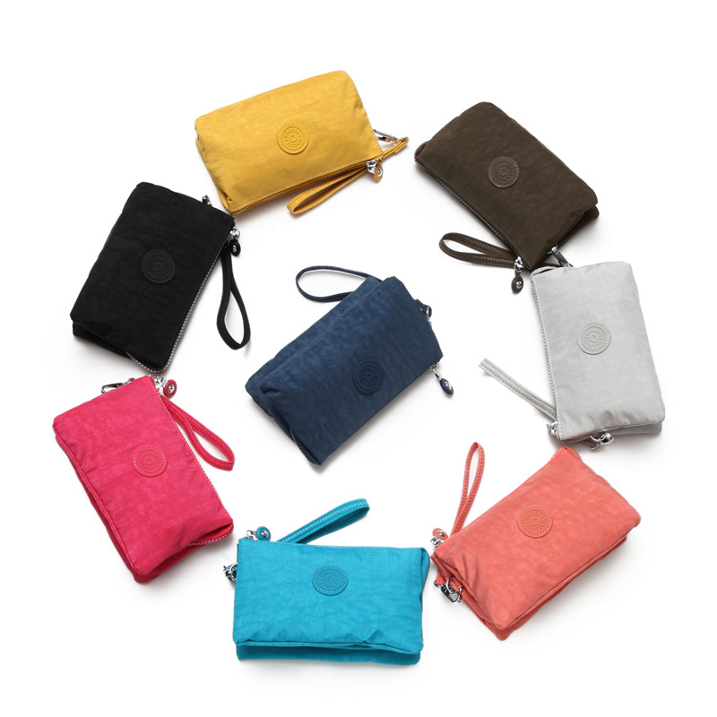 Bolsa de mano de nylon multicapa de gran capacidad a prueba de derrames de agua de mujer simple de moda larga cremallera cambio pasaporte bolso móvil