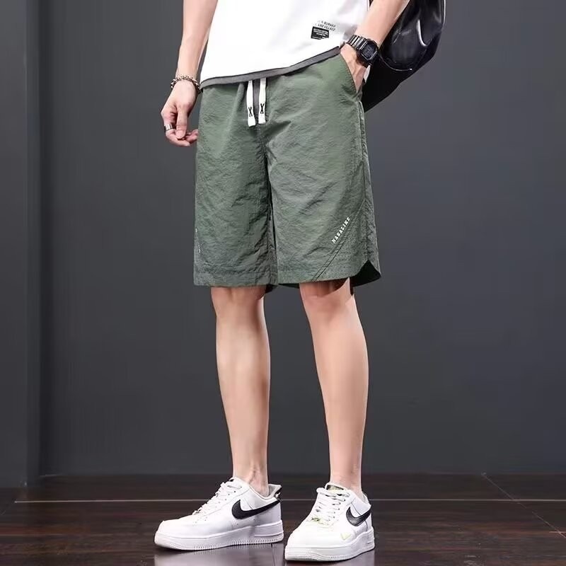 Camisas, menos ropa, pantalones de verano de cinco puntos, holgados y cómodos, todo-fósforo, pantalones casuales de estilo de Hong Kong, deportes para hombres, hombres estadounidenses, de secado rápido