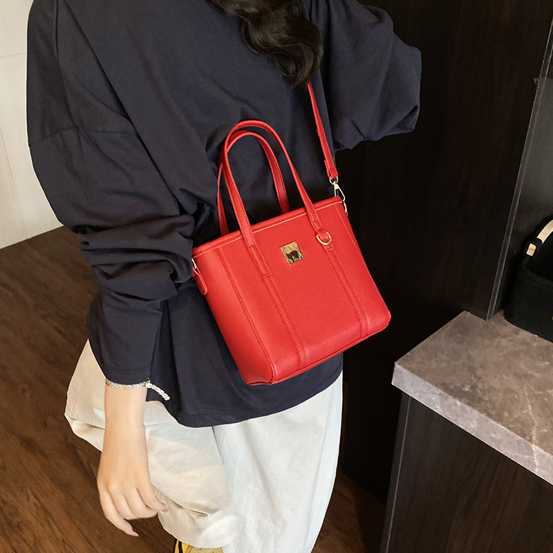 Tendencias de moda de comercio exterior bolso de cubo de mano femenino 2025 nuevo estilo estilo occidental bolso de hombro todo fósforo bolso de mensajero de viaje de trabajo