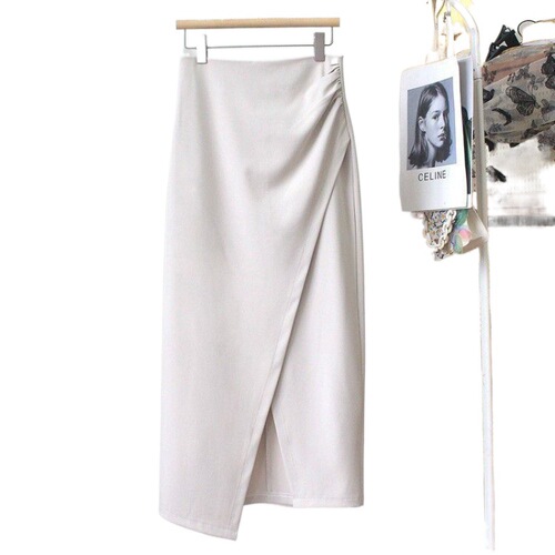 A mid-length dress with a high waist, featuring an irregular hemline, side slits, and a fitted silhouette, combining the style of a tailored blazer with the flair of a autumnal pleated skirt.