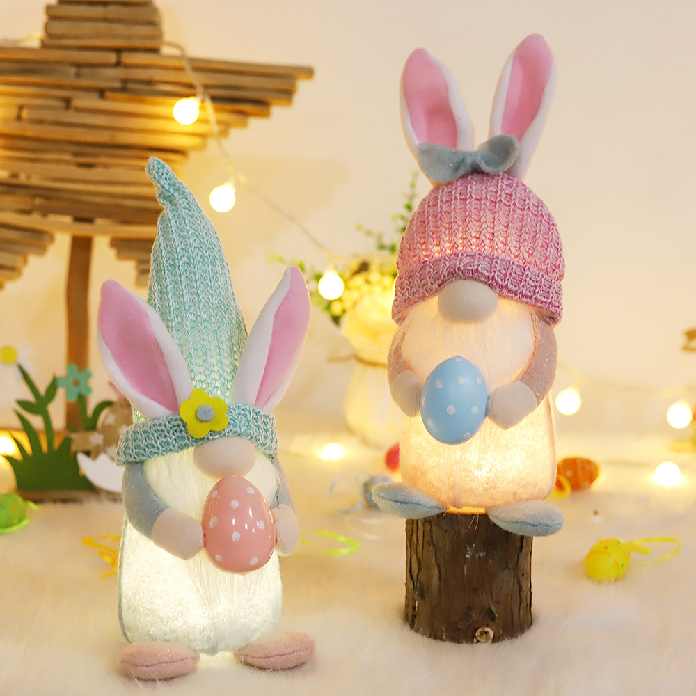 Nuevas decoraciones de Pascua que emiten luz sin rostro muñeca vieja Orejas de conejo sosteniendo colorido huevo enano muñeca adornos