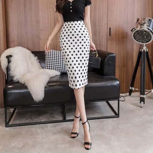 The trendy half-length skirt with polka dots, high waist, and hidden slits, offering a flattering fit for spring and autumn.