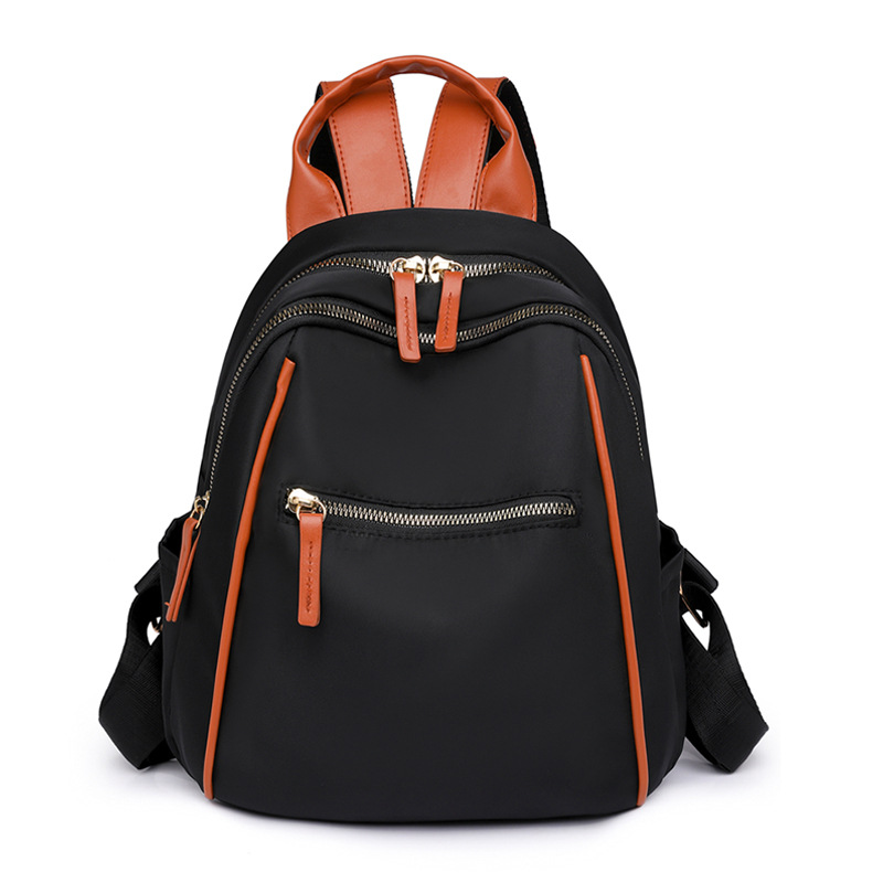 Mochila portátil para mujer 2024 nuevo estilo nylon fuera de viaje mochila simple bolsa de escuela de estudiante de gran capacidad al por mayor