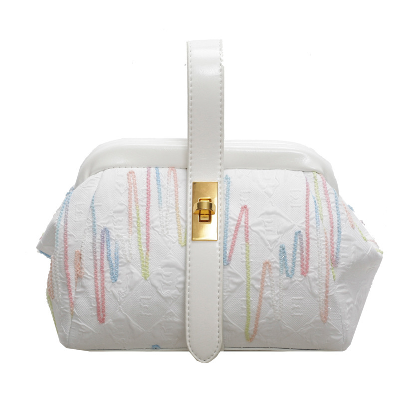 2024 otoño e invierno nuevo estilo bolso de diseño de nicho costuras de moda bolso de mensajero de hombro casual de todo fósforo bolso femenino de cercanías