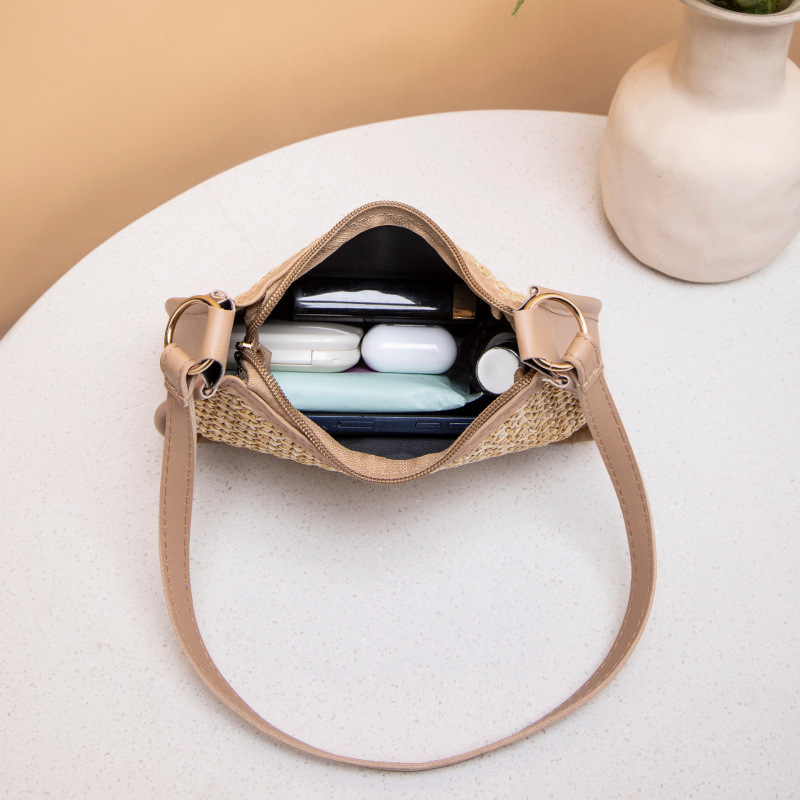 Fresco dulce 2025 nuevo bolso de paja de mujer, bolso de hombro de moda versátil, bolso de brazo de mujer nicho