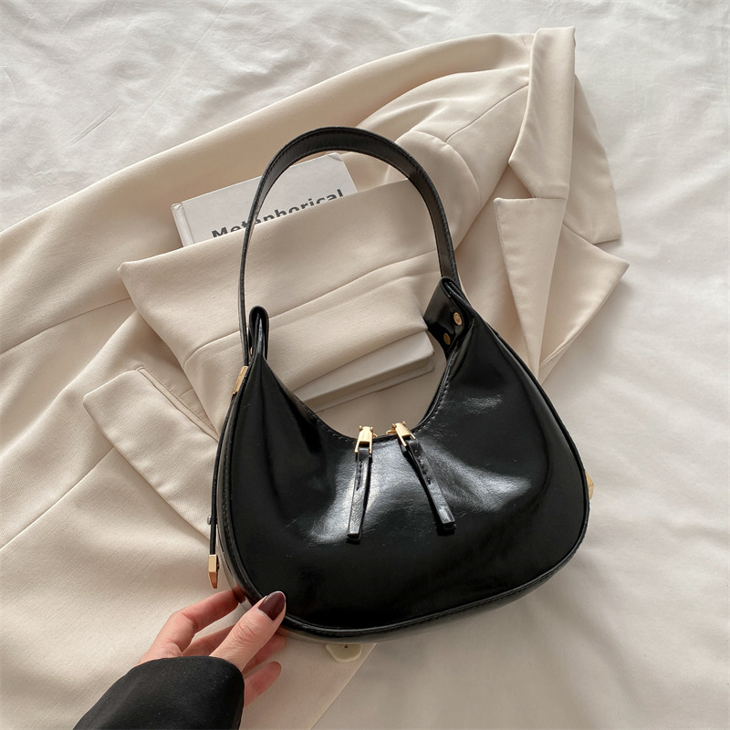 Estilo coreano ins 2025 primavera y verano nuevo diseño de nicho celebridades de Internet damas con un solo hombro y axilas albóndigas paquete de medio mes