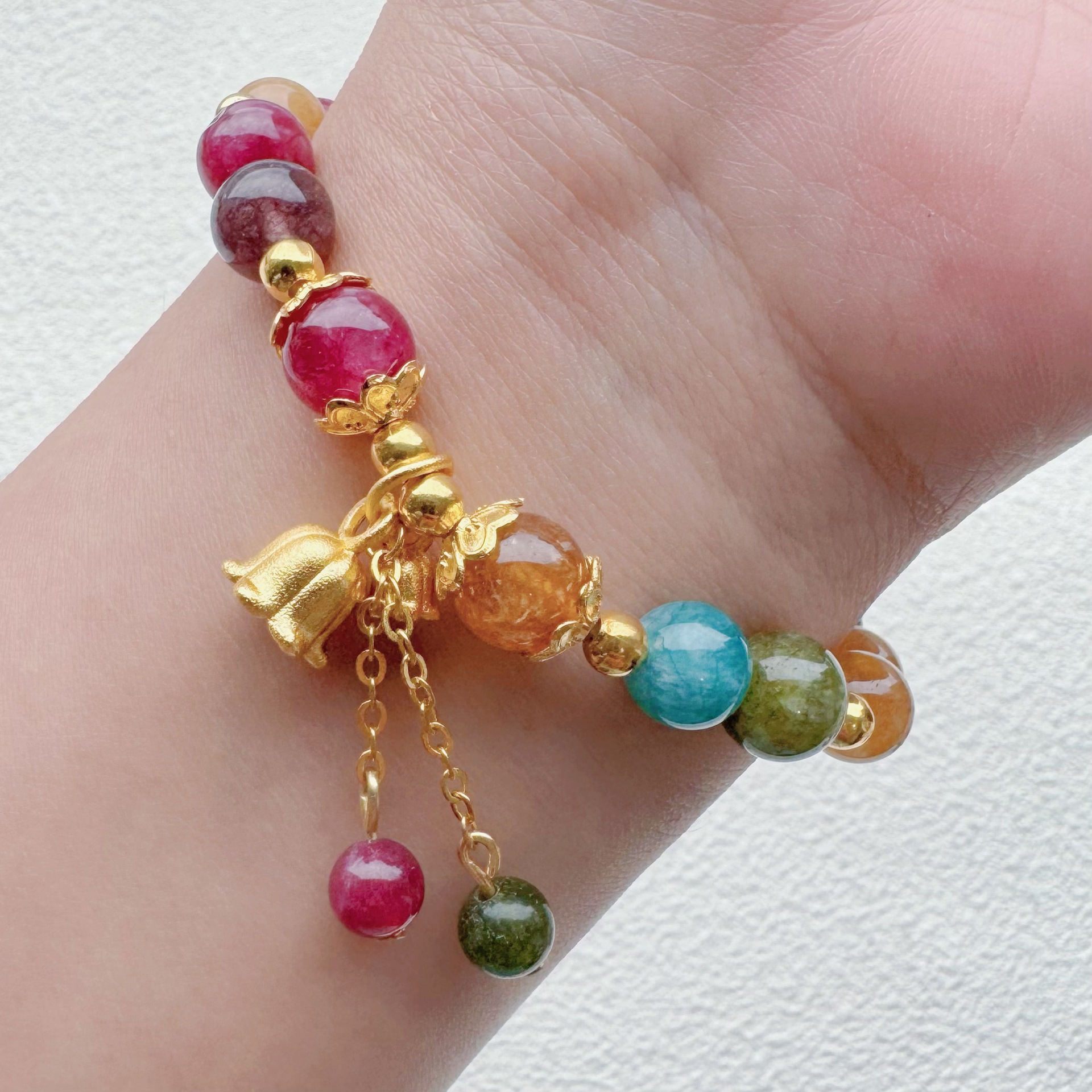 Pulsera de cristal de fresa de piedra natural orquídea colgante de campana de viento nacional lugar escénico para poner puestos nuevos joyeros chinos al por mayor