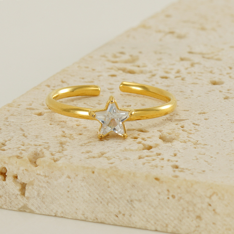 Nuevo anillo de estrella de circón con incrustaciones de acero inoxidable transfronterizo para mujeres anillo de acero de titanio de lujo ligero versátil europeo y americano en stock al por mayor