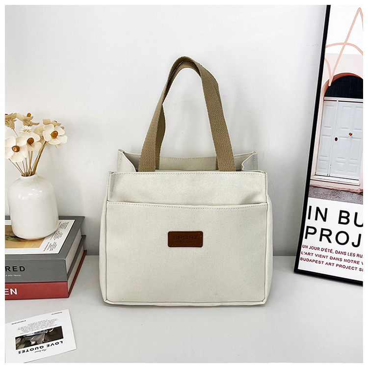 New wholesale fashionable and high-quality canvas handbag, simple and portable, easy to carry for going out, versatile lunch box and bento bag undefined