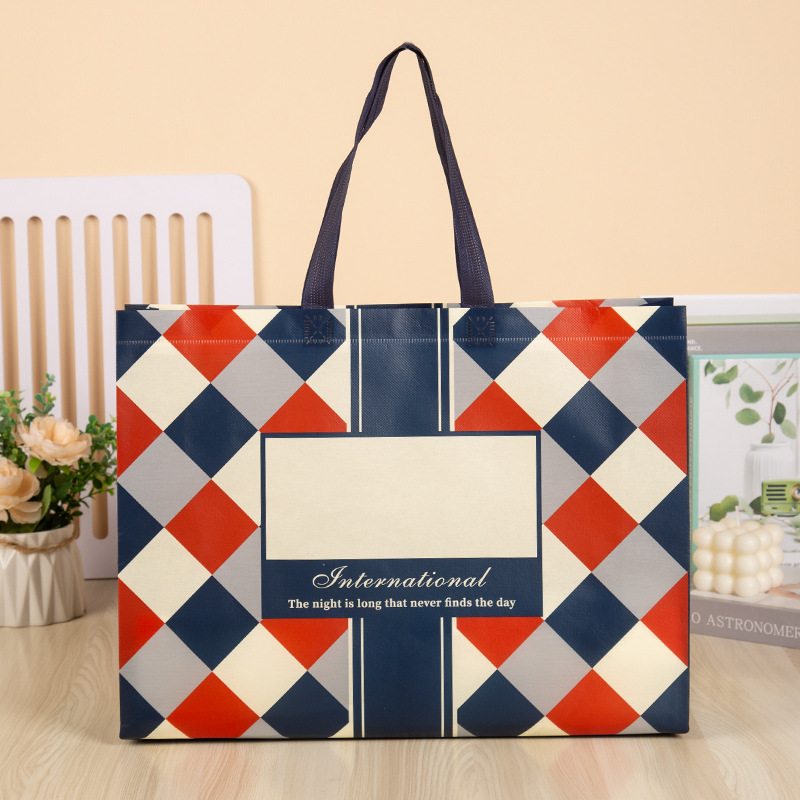 Bolso no tejido al por mayor de la ropa revestida bolso de compras de las mujeres impreso LOGOTIPO bolsa de regalo bolso no tejido bolso de mano