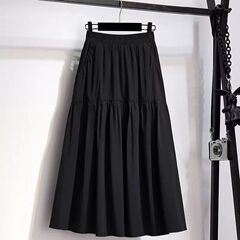夏のポケットの半身のスカートの女性の爆発的なa字の膝の黒いスカートの中の長いタイプの高級感の百合の通勤傘のスカート