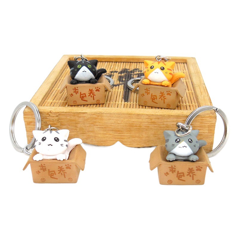 Gato de dibujos animados llavero colgante lindo gato muñeca estudiante adornos campus tienda suministro al por mayor