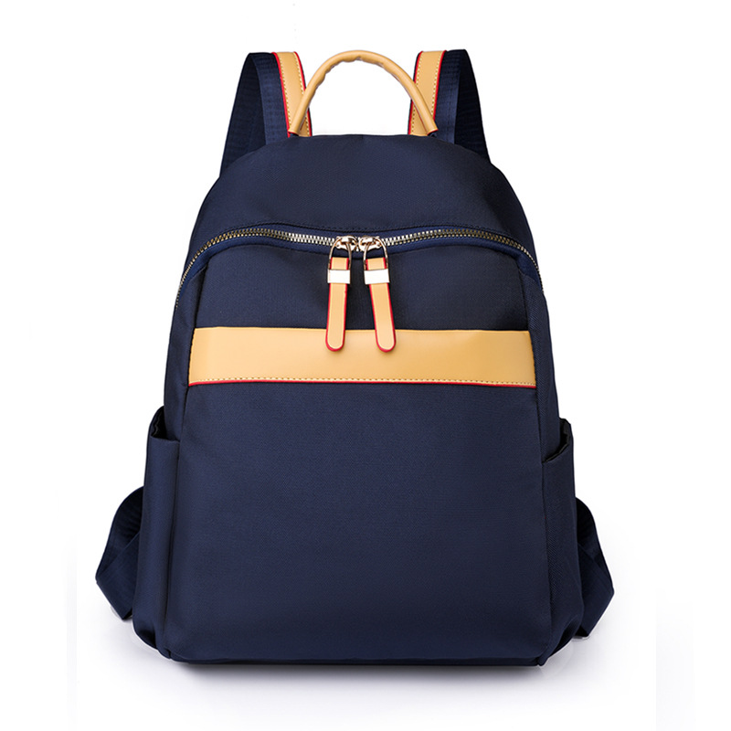 2023 nueva mochila de nailon para mujer de color de contraste moda simple de gran capacidad mochila de viaje al aire libre mochila escolar al por mayor