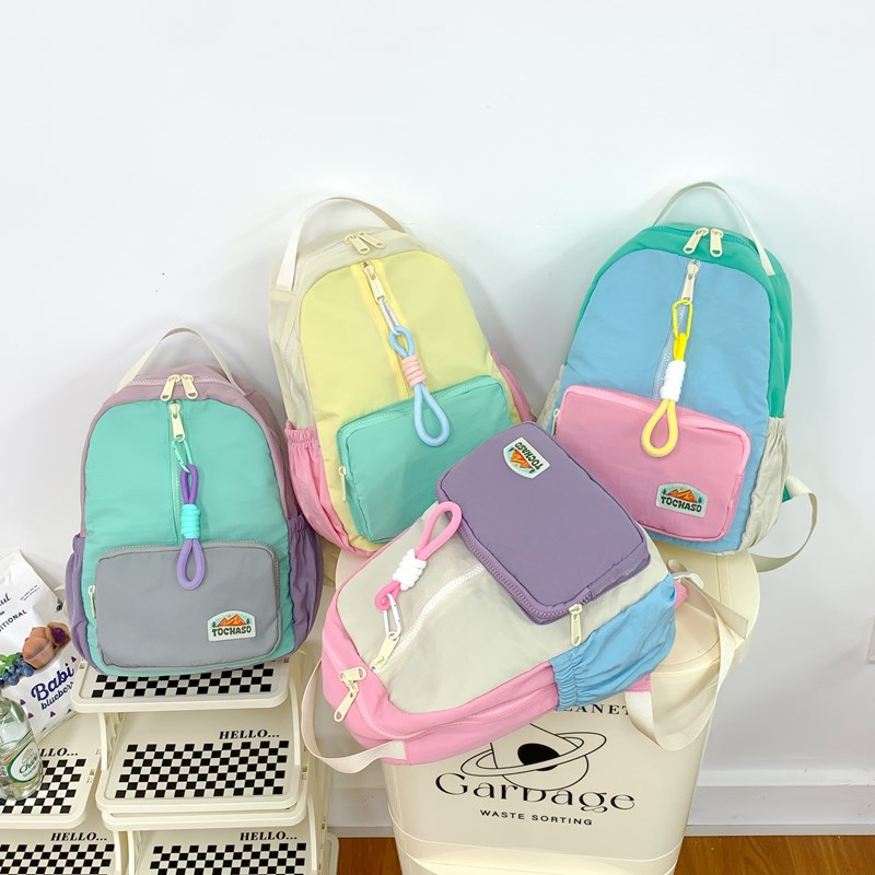 Hombres y niñas mochila 2025 nueva moda empalme color contraste jardín de infantes mochila de bebé mochila de gran capacidad para niños