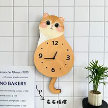 可爱小猫咪挂钟客厅尾巴摇摆创意挂墙钟表时钟家用静音动物装饰品