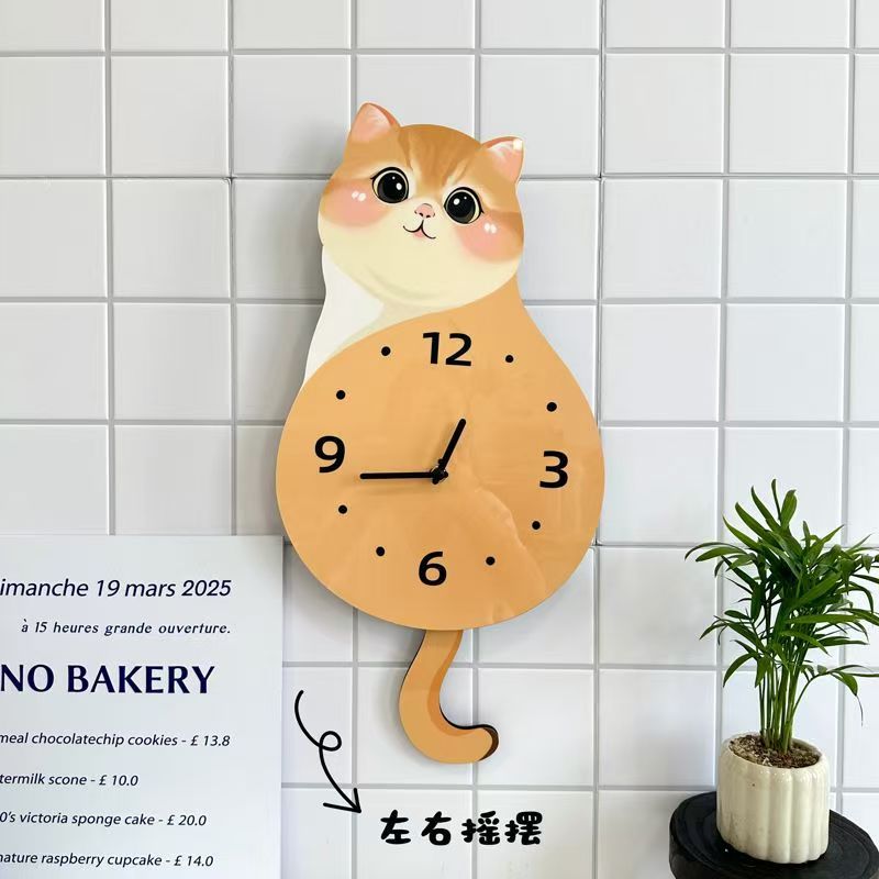 可爱小猫咪挂钟客厅尾巴摇摆创意挂墙钟表时钟家用静音动物装饰品