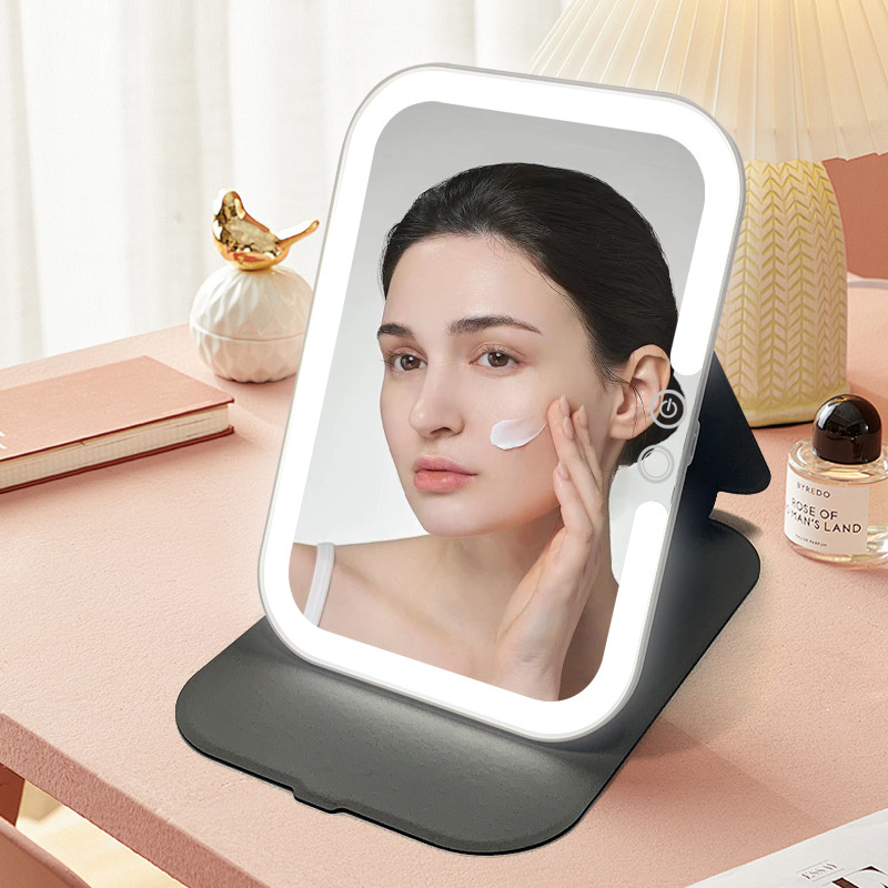 Espejo de maquillaje LED explosivo transfronterizo portátil plegable portátil con espejo de tocador recargable con luz espejo de funda de cuero con luz de relleno de escritorio