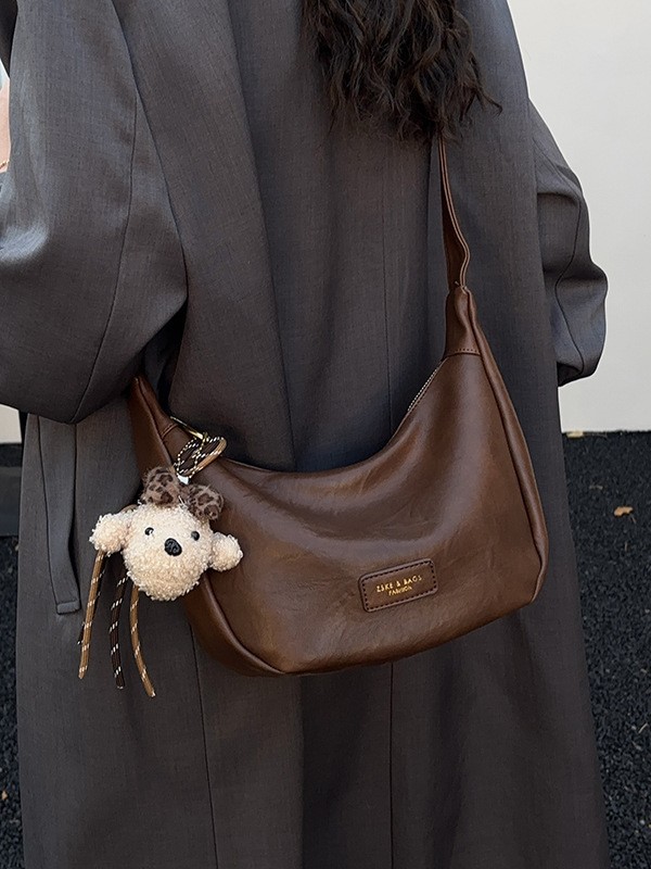 Bolsa de moda coreana bolsas de bollo de moda mujeres 2025 nuevo estilo simple ocio textura alta versátil mochila de hombro