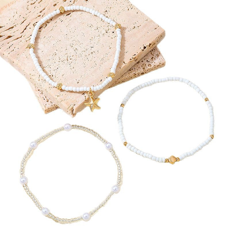 Bohemia estilo vacaciones aleación estrella de mar vieira árbol de la paz colgante color aleatorio cuentas de arroz juego de tobillera elástica