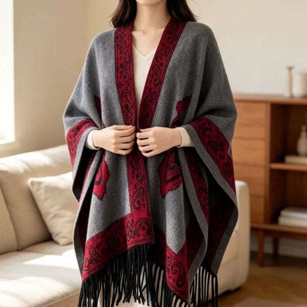 Women's cape-style outerwear, suitable for spring and autumn, with a traditional Chinese design, ethnic patterns, and a long, open-front style. It resembles a faux wool blanket and can be worn as a shawl or outer layer for warmth
