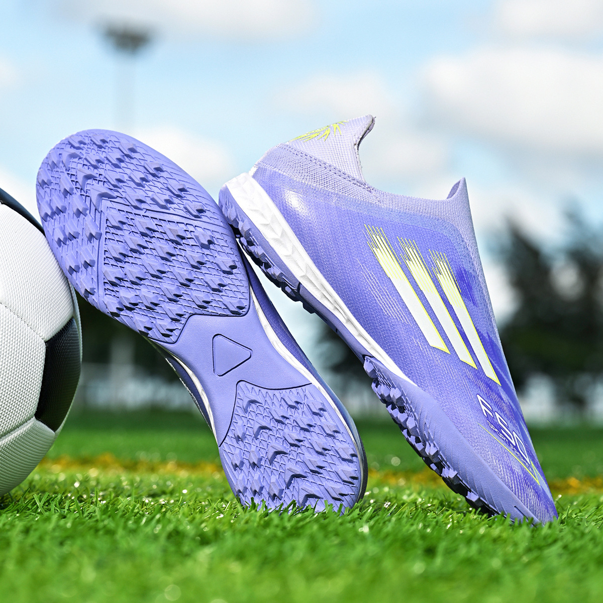 Zapatos de fútbol infantiles transfronterizos, zapatos de fútbol adolescentes masculinos, estudiantes, zapatos de fútbol femeninos TF, zapatos de fútbol aggravar al por mayor