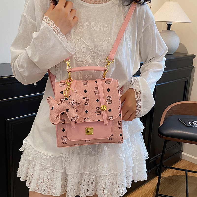 Mochila de moda coreana para mujer, bolso de mensajero con estampado de moda ringge de estilo occidental, bolso de viaje con colgante de cachorro lindo