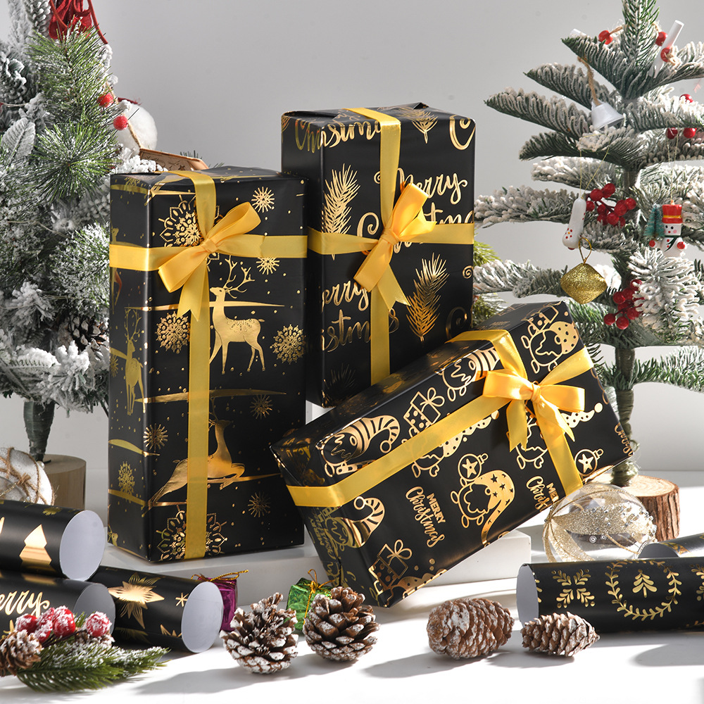 Nuevo papel de regalo de oro negro de Navidad transfronterizo papel de cobre brillante copo de nieve papel de regalo de ciervo de Navidad papel de regalo