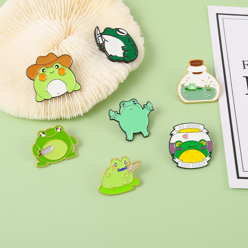 Amazon Venta caliente popular familia animal aleación broche de dibujos animados lindo Rana con forma de cuchillo goteo insignia