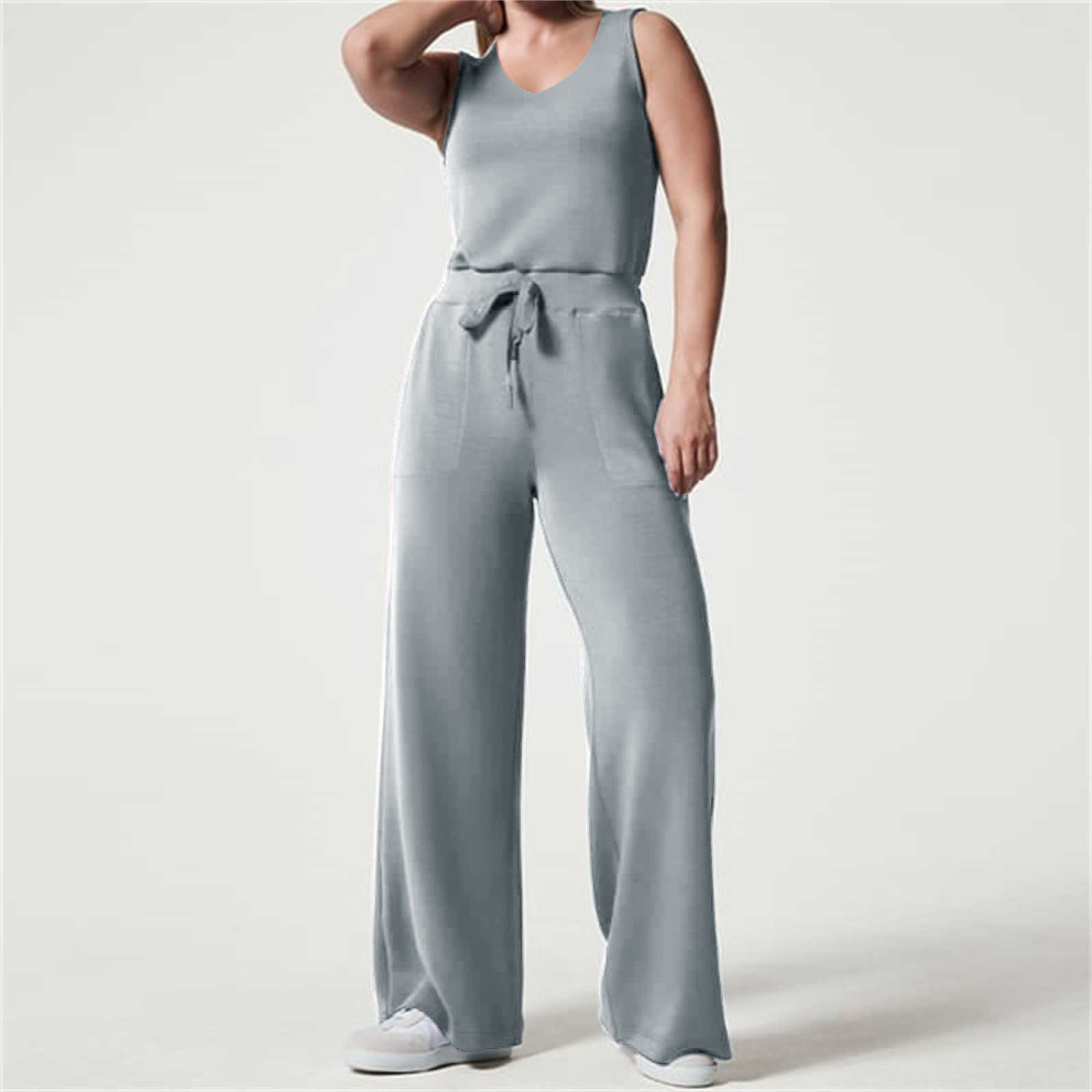 2023 primavera y verano nuevo versátil moda europea y americana adelgazamiento ocasional de las mujeres sin mangas color sólido V-cuello pantalones jumpsuit