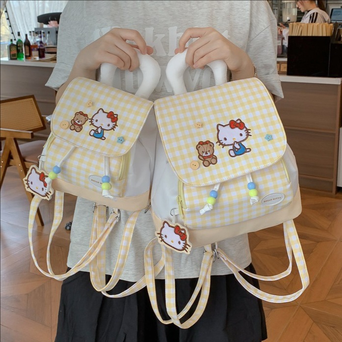 Cartoon yellow cat drawstring flap backpack, niche design, cute backpack for girls, suitable for casual outings and as a school bag