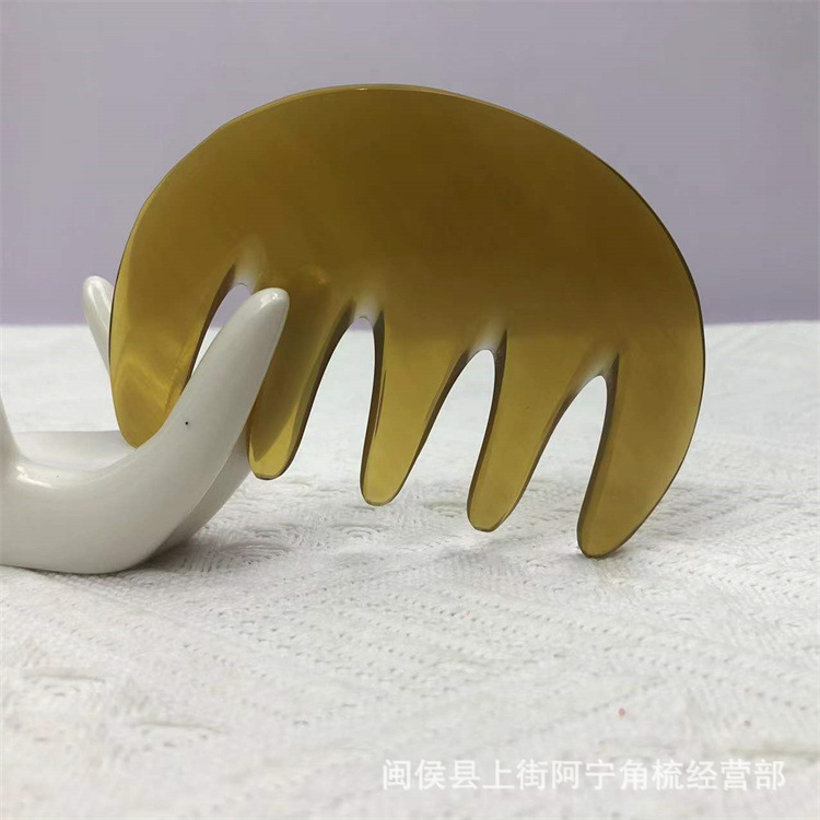 African Horn Five-Tooth Massage Comb Gua Sha Comb with Meridian Wand Dolphin Board 9.5cm in use