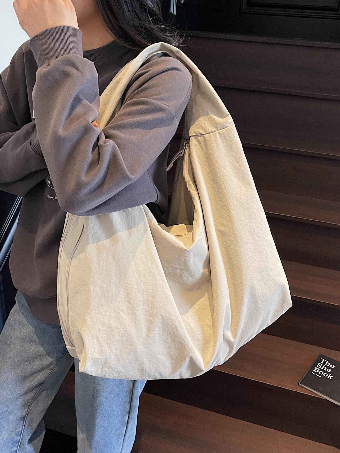 Bolso de axila de estilo explosivo de comercio exterior para mujer de gran capacidad 2025 nuevo bolso de hombro casual de tela de nailon bolso de moda simple