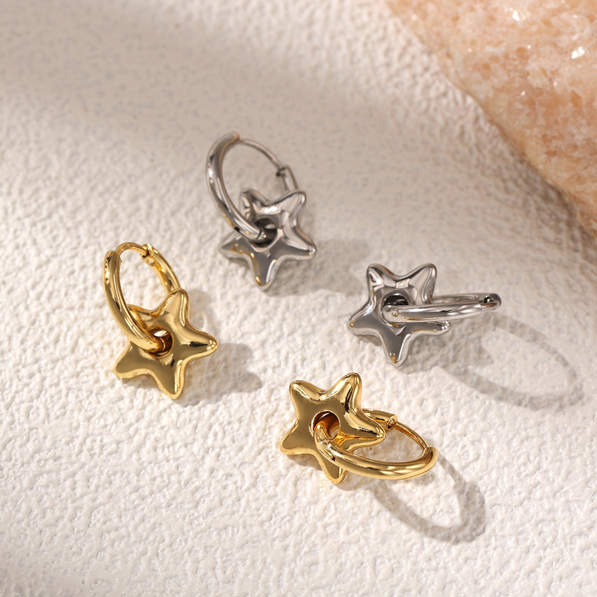 Taina europa y americana auriculares de acero inoxidable lujosos personales estilo de lujo universal estrellas colgantes pendientes de acero de aluminio nicho de alta calidad para mujeres