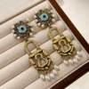 2512116 Eye Pearl Tassel Earrings