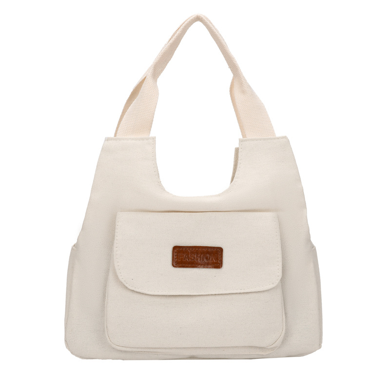 2024 invierno nuevo paquete de viaje japonés retro nicho sensación de diseño bolso de lona simple color sólido bolso casual