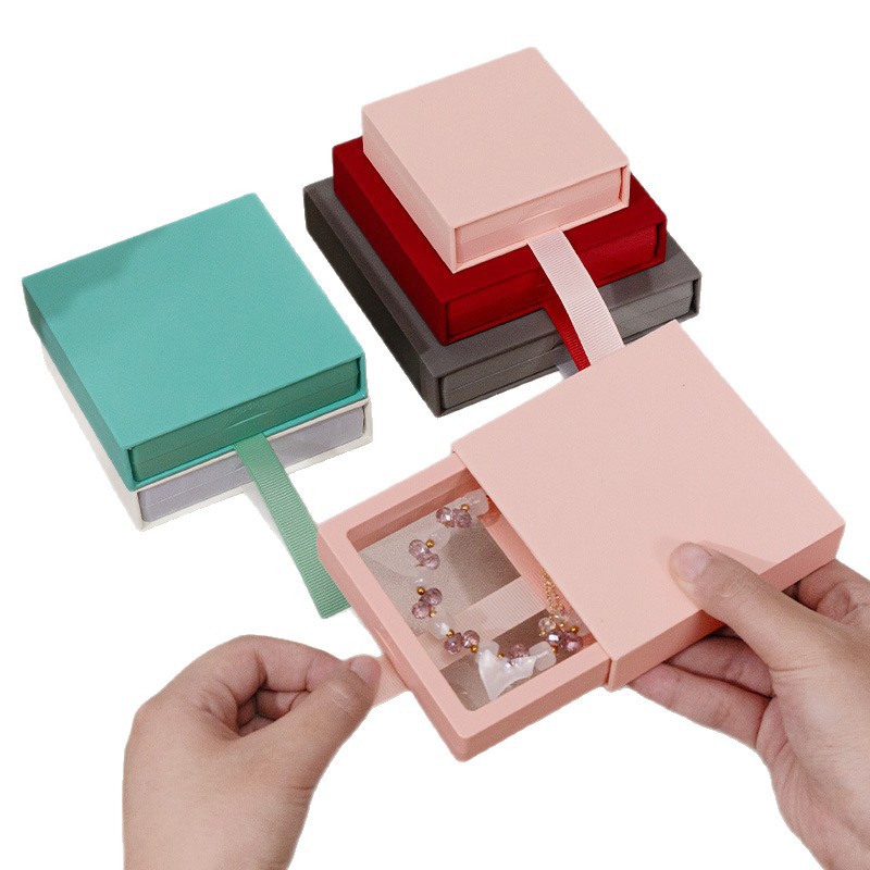 Cajón de stock Caja de suspensión Caja de joyería de almacenamiento PE Cubierta de papel Anillo Collar pendientes Caja de embalaje de joyería antioxidante
