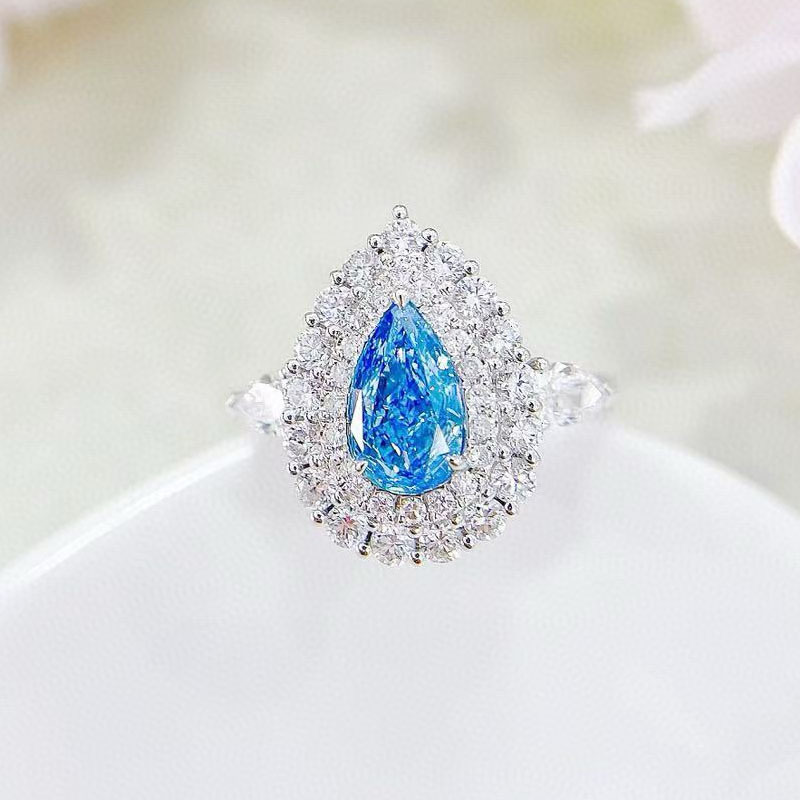 18K white gold pear-shaped diamond ring with cultured blue diamond, suitable for engagement or wedding; teardrop diamond ring; wedding band with 1 carat diamond.